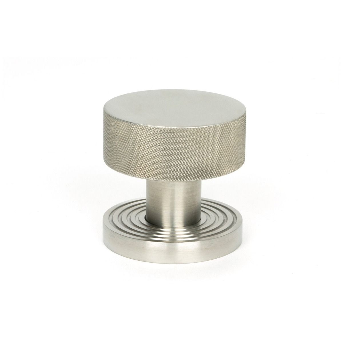 The Knurled Mortice/Rim Knob Set on a Beehive Rose in Satin Stainless Steel Shown Upright on a White Background 