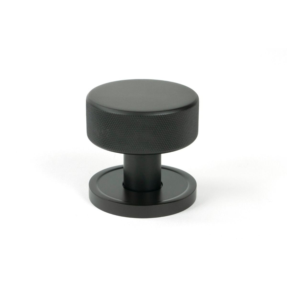 The Knurled Mortice/Rim Knob Set on a Plain Rose in Aged Bronze Shown Upright on a White Background 