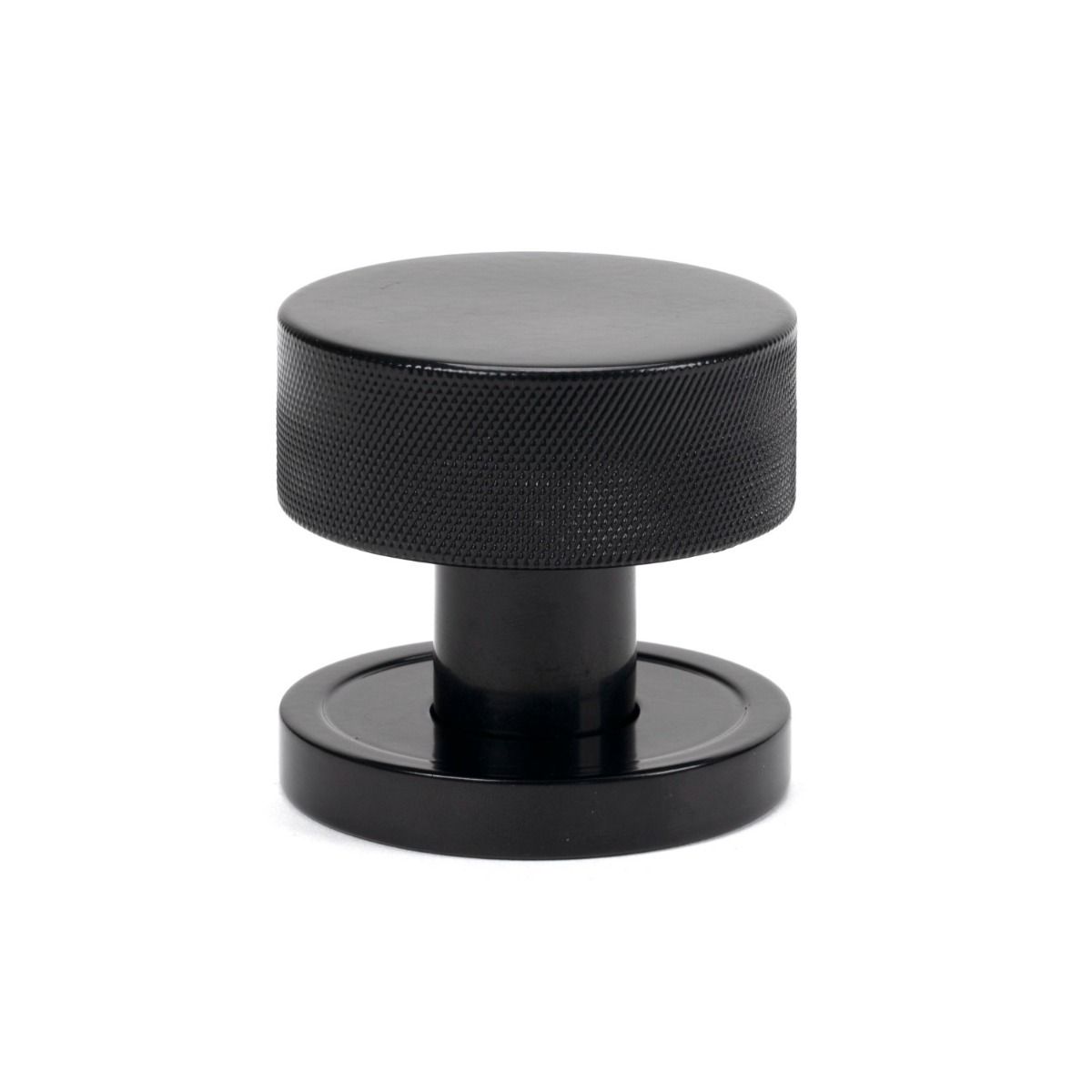 The Knurled Mortice/Rim Knob Set on a Plain Rose in Black Shown Upright on a White Background 