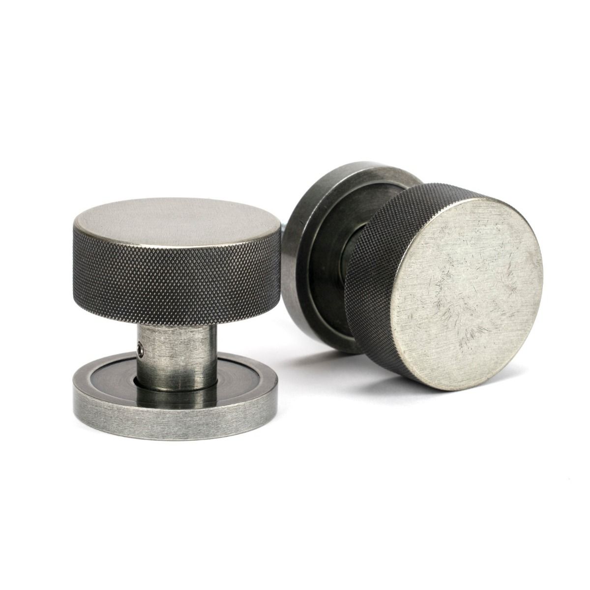 The Knurled Mortice/Rim Knob Set on a Plain Rose in Pewter Shown Upright and on its Side 