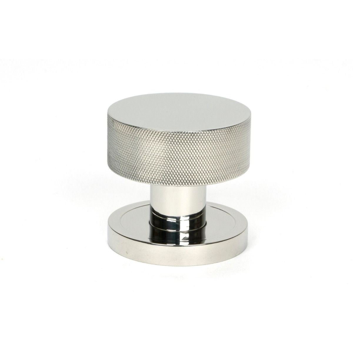 The Knurled Mortice/Rim Knob Set on a Plain Rose in Polished Stainless Steel Shown Upright on a White Background 