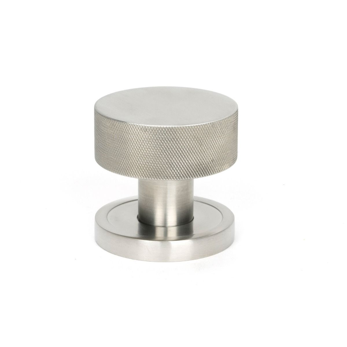 The Knurled Mortice/Rim Knob Set on a Plain Rose in Satin Stainless Steel Shown Upright on a White Background 