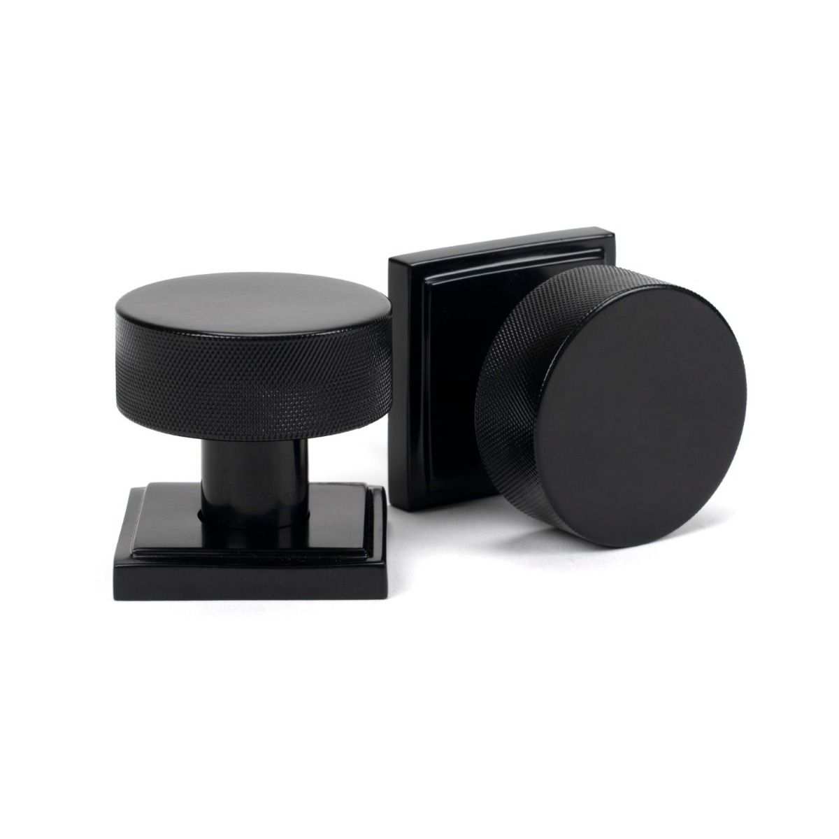 The Knurled Mortice/Rim Knob Set on a Square Rose in Black Shown Upright and on its Side 
