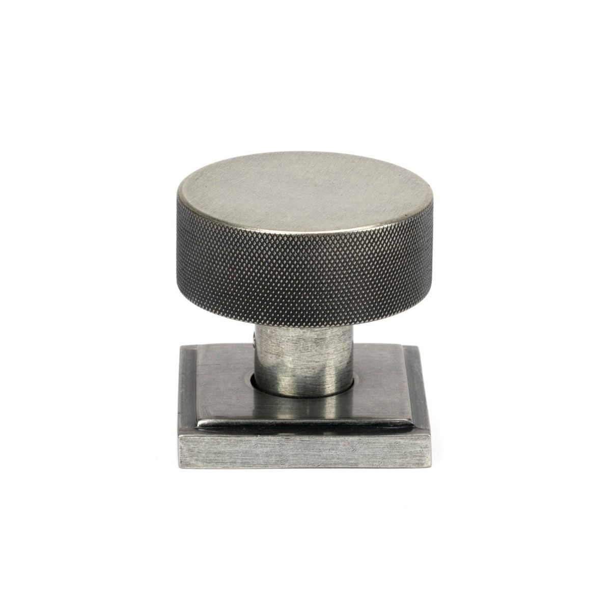 The Knurled Mortice/Rim Knob Set on a Square Rose in Pewter Shown Upright on a White Background 