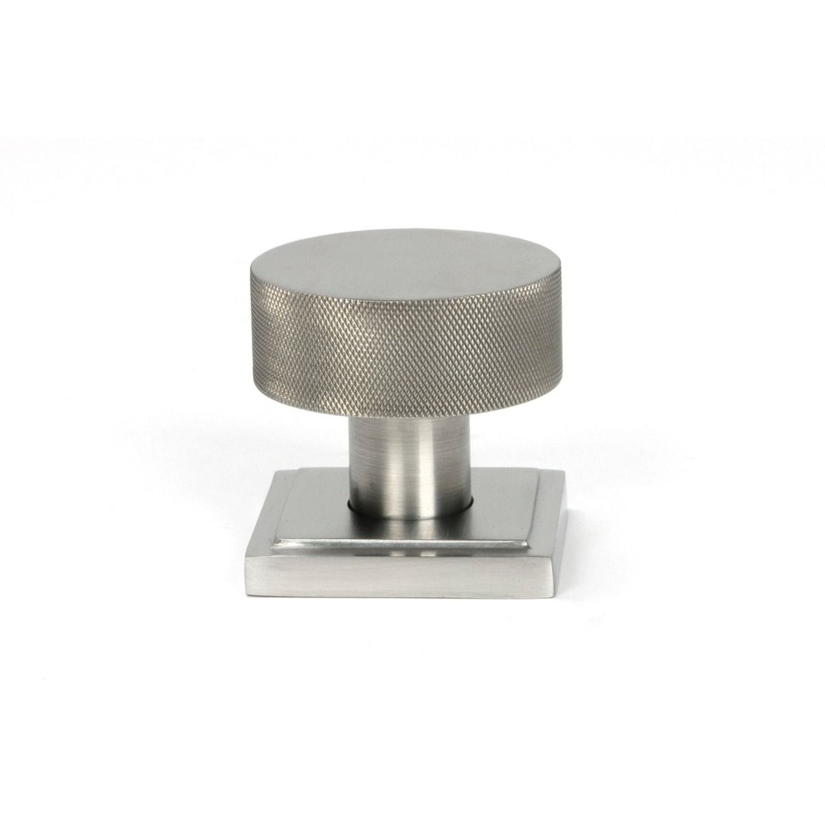 The Knurled Mortice/Rim Knob Set on a Square Rose in Satin Stainless Steel Shown Upright on a White Background 