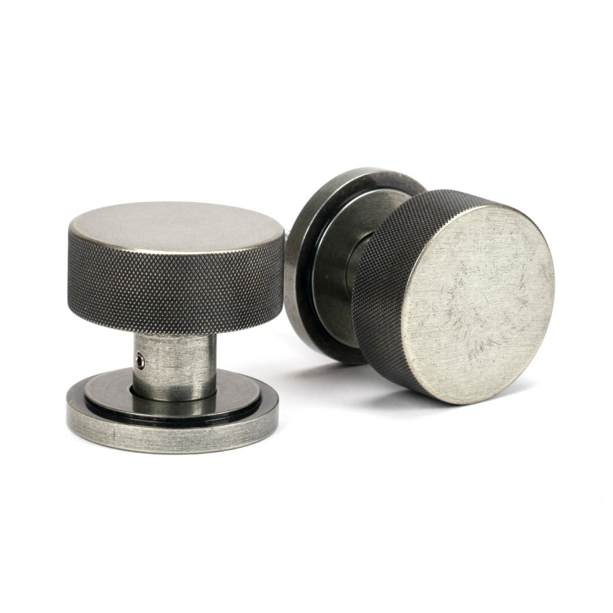 The Knurled Mortice/Rim Knob Set on an Art Deco Rose in Pewter Shown Upright and on its Side 