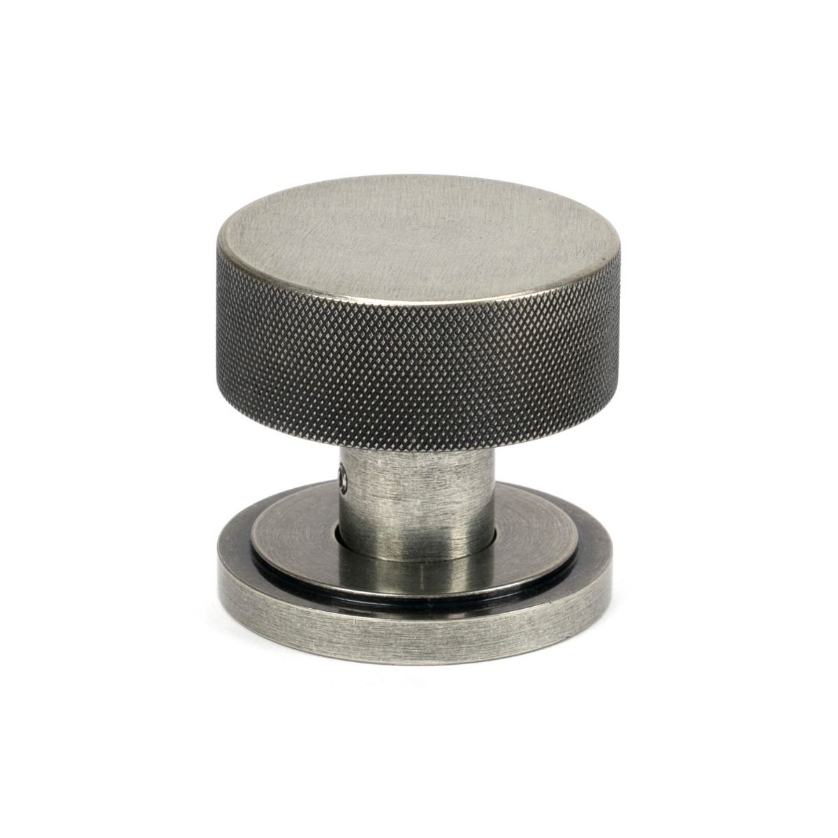 The Knurled Mortice/Rim Knob Set on an Art Deco Rose in Pewter Shown Upright on a White Background 