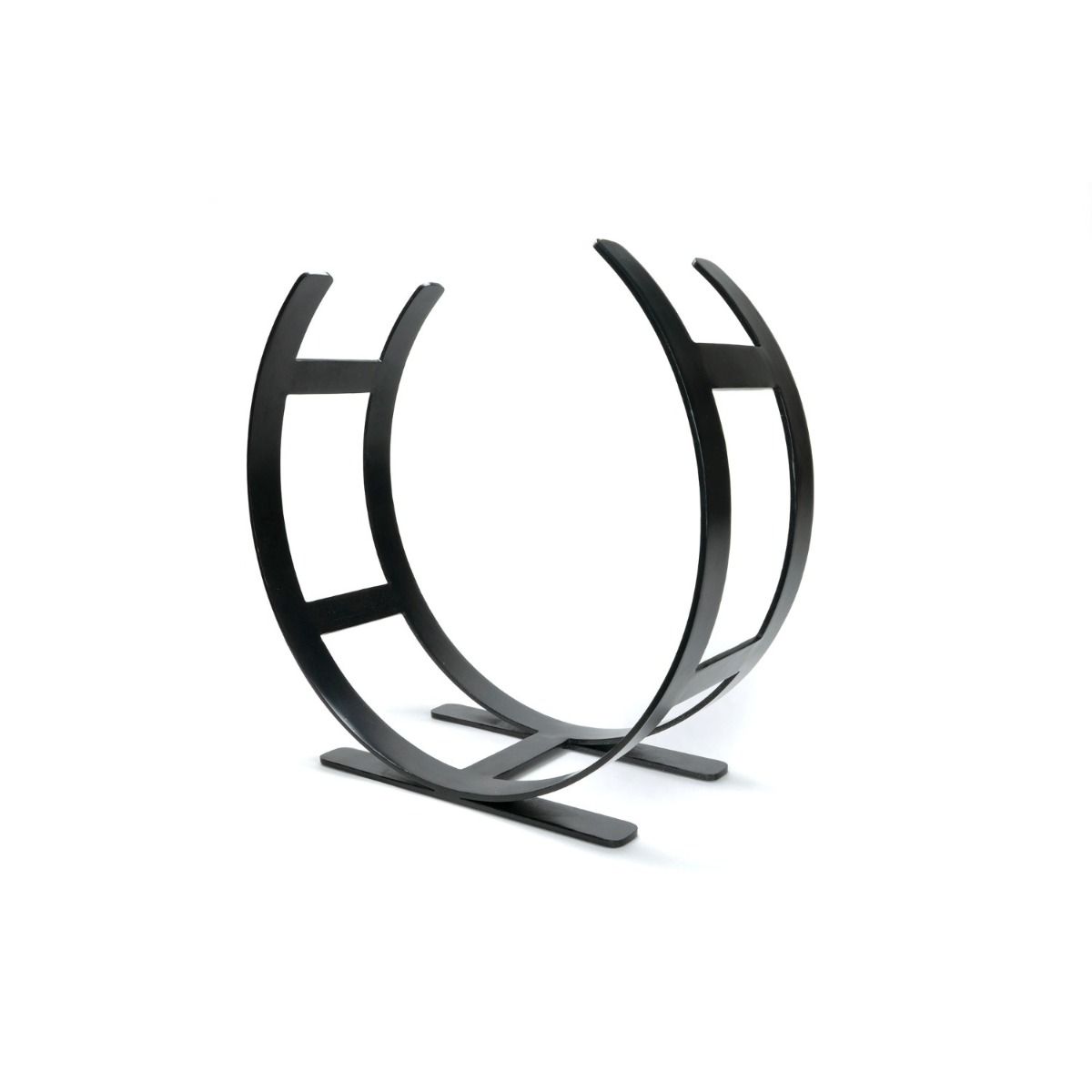 The Large Curved Fireside Log Holder in Matt Black Shown from an Angle on a White Background