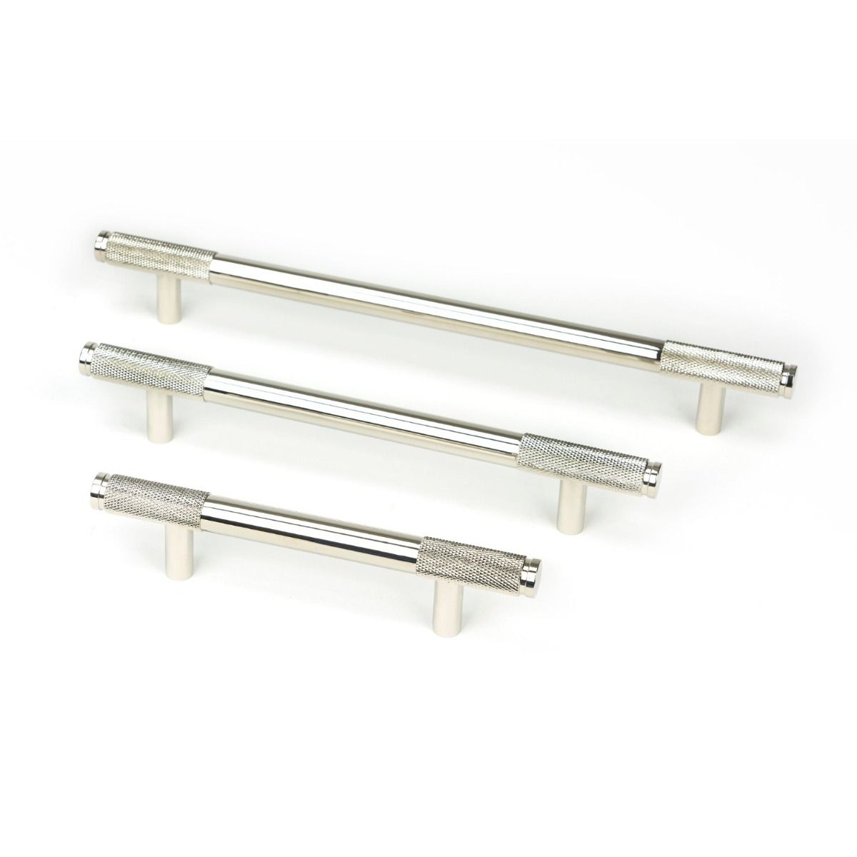 The Large Knurled Cabinet Pull Handle in Polished Nickel Shown Alongside Other Sizes on a White Background