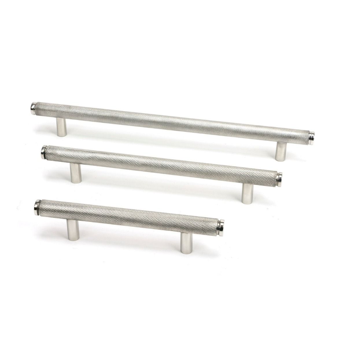 The Large Knurled Cabinet Pull Handle in Polished Stainless Steel Shown Alongside Other Sizes on a White Background