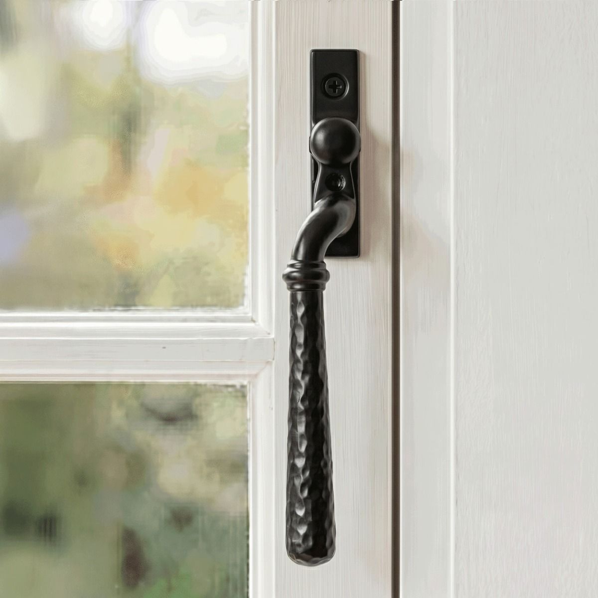 The Right Handed 16mm Hammered Black Espagnolette Window Handle Fitted on a Wooden Traditional Window Frame - Digital Illustration 