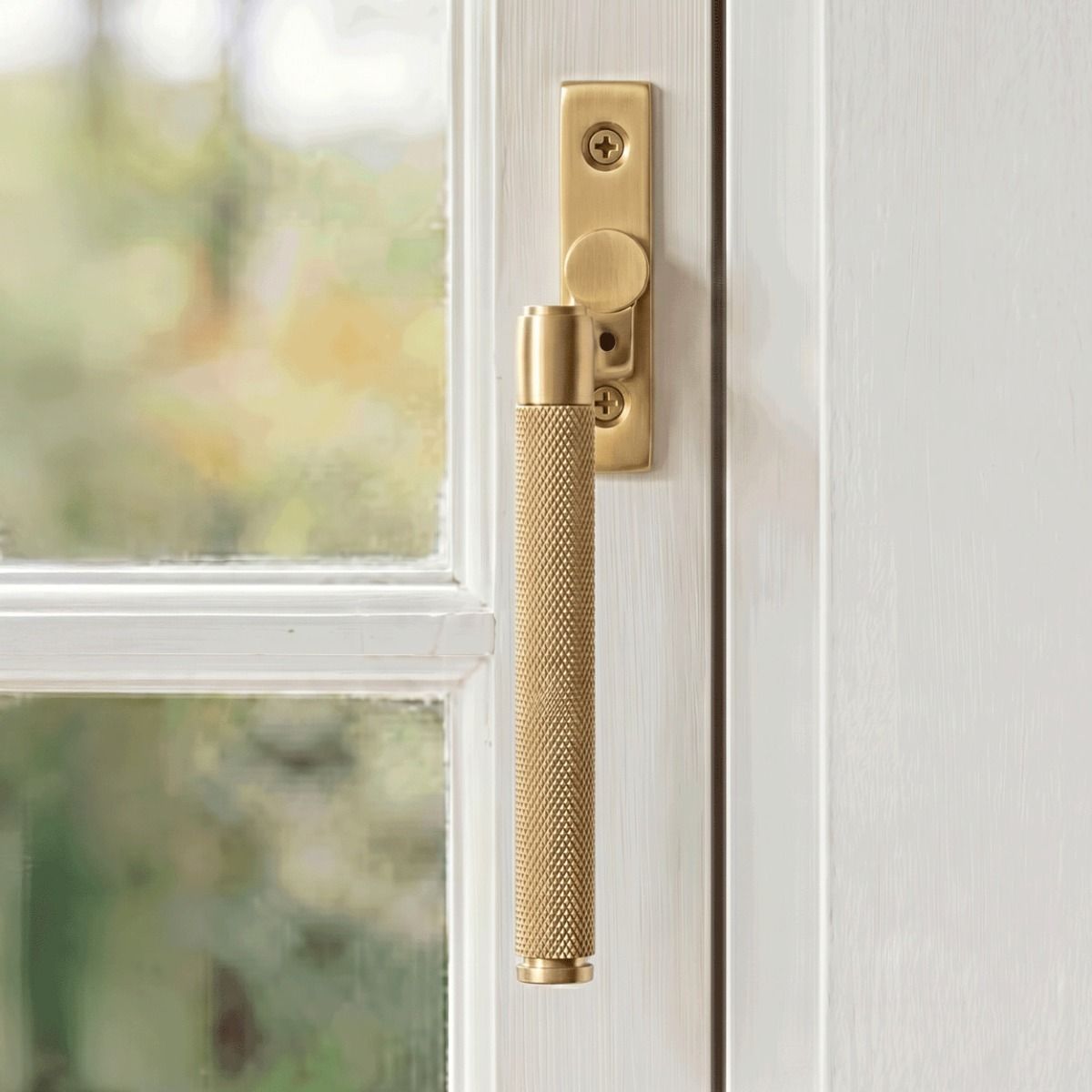 The Right Handed 16mm Satin Brass "Royale" Espagnolette Window Handle Fixed on a Handpainted White Window Frame - Digital Illustration 