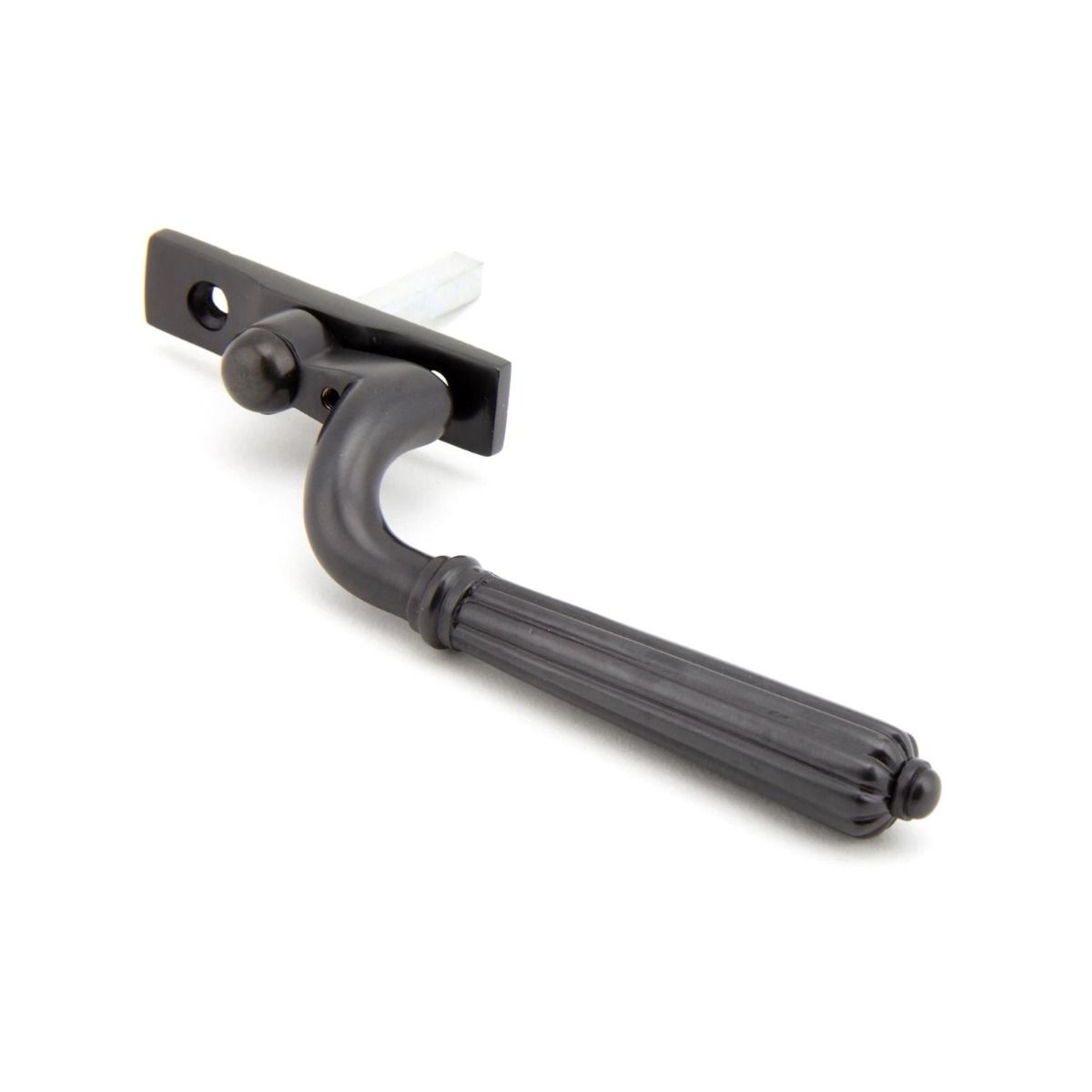 The Left Handed Aged Bronze Reeded Georgian Espagnolette Window Handle on a White Background on a White Background Shown on its Side 
