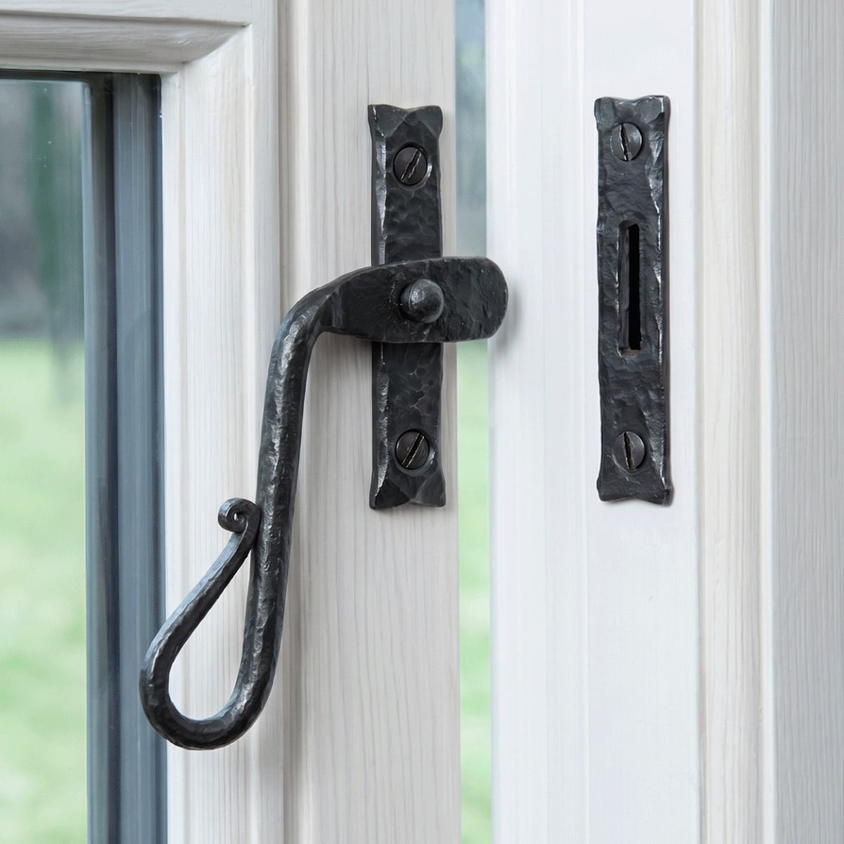 The Left Handed Bees Wax Shepherds Crook Window Fastener Mounted on a White Painted Window Frame Opened Position - Digital Illustration