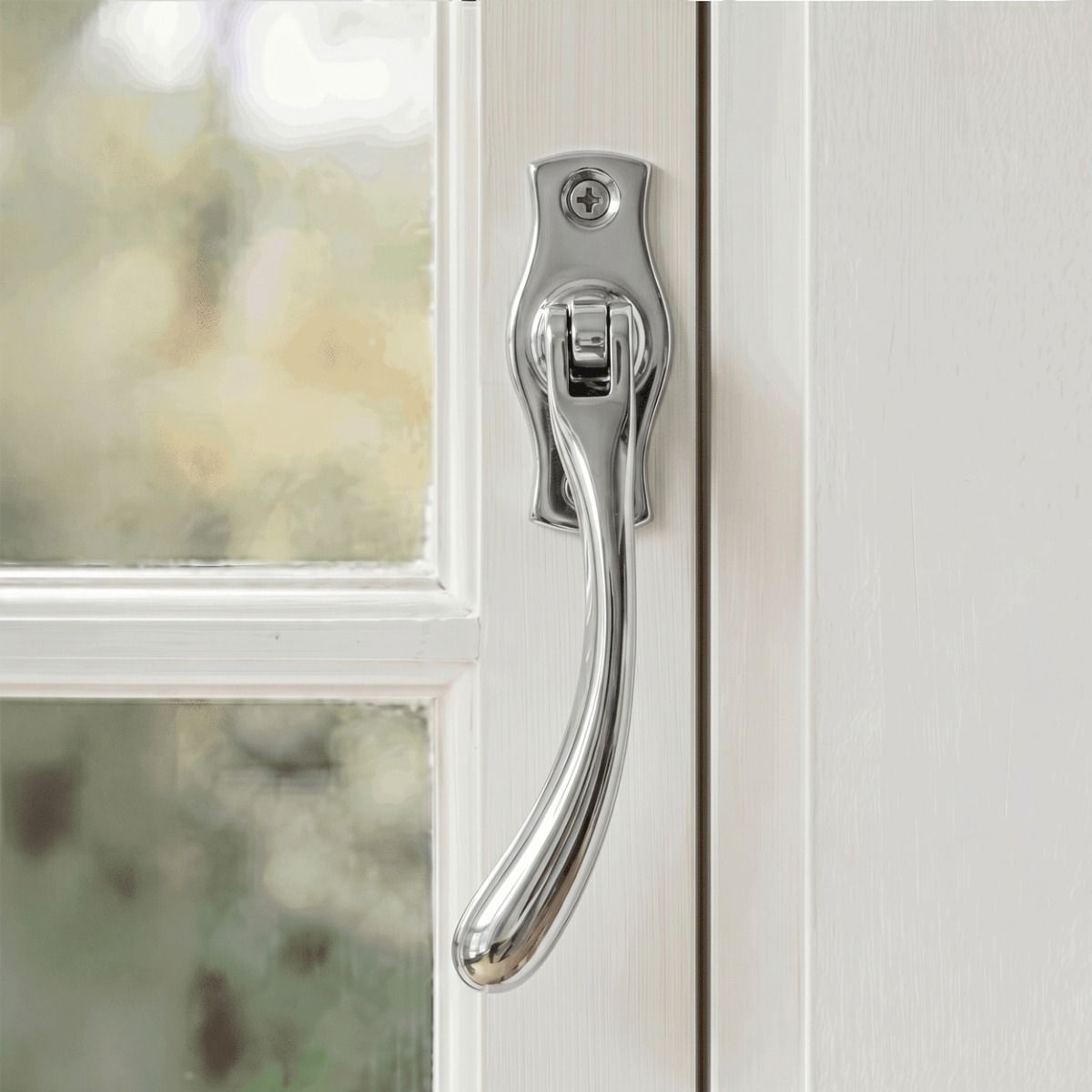 The Left Handed Polished Chrome Peardrop Window Handle Fitted on a White Window Frame in a Country Home - Digital Illustration