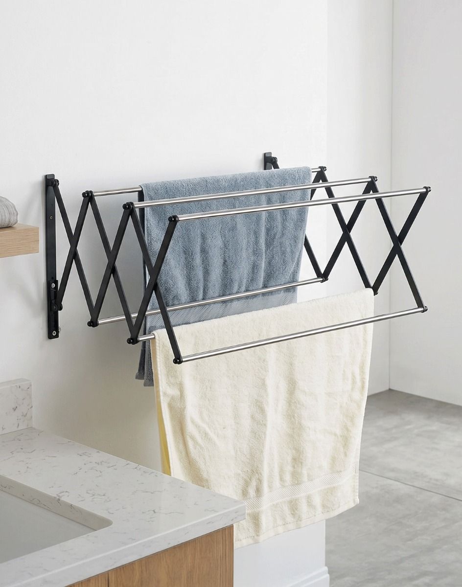 The Lindham Spacesaving Foldaway Towel Rack Mounted on a Wall Next to a Bath - Digital Illustration