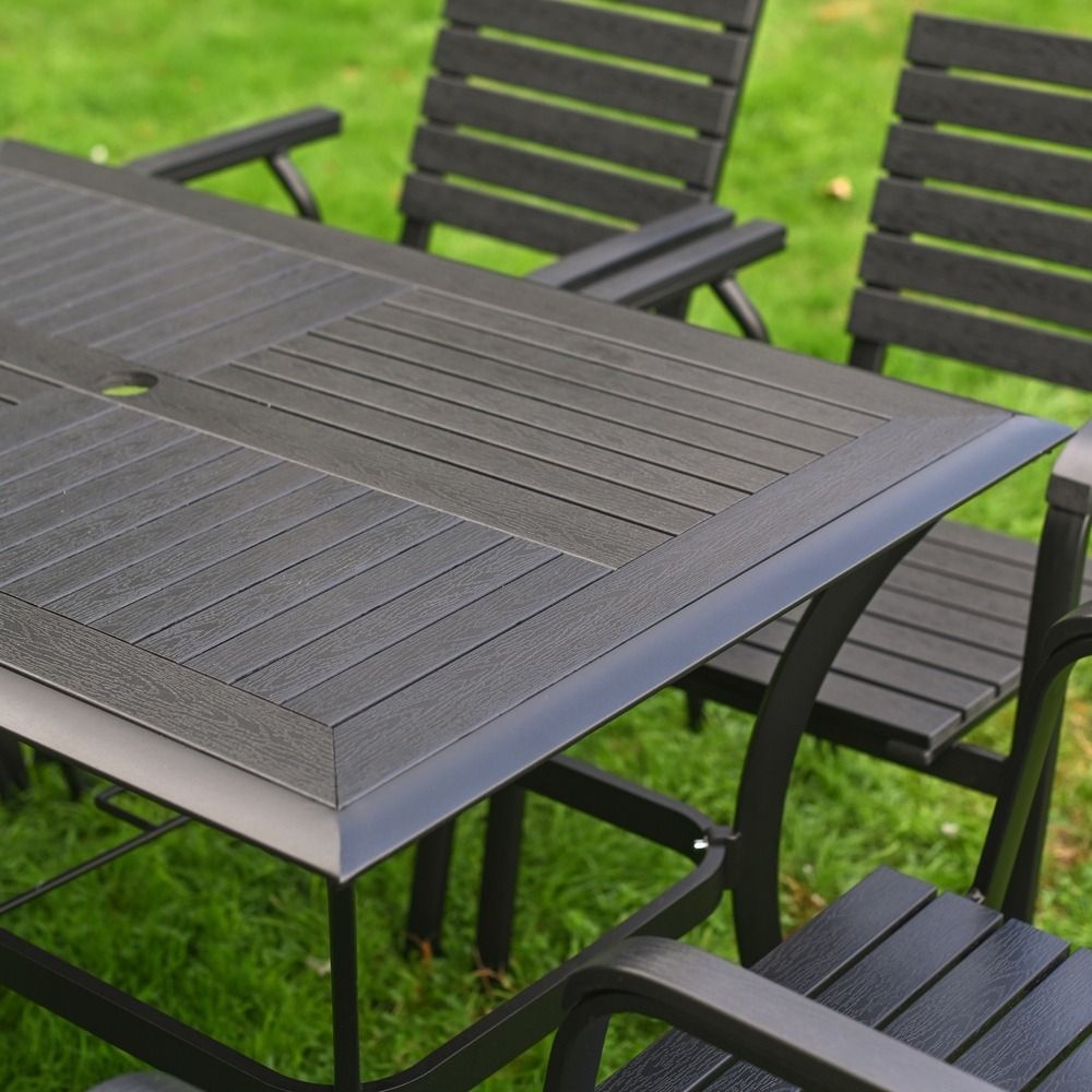 The Linea 6-Seater Outdoor Garden Dining Set in Black Showing a Close up of the Alternate Patterned Wood Effect Table Top
