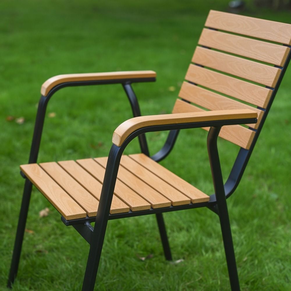 The Linea 6-Seater Outdoor Garden Dining Set in Teak Showing a Side view of the Wood Effect Chairs
