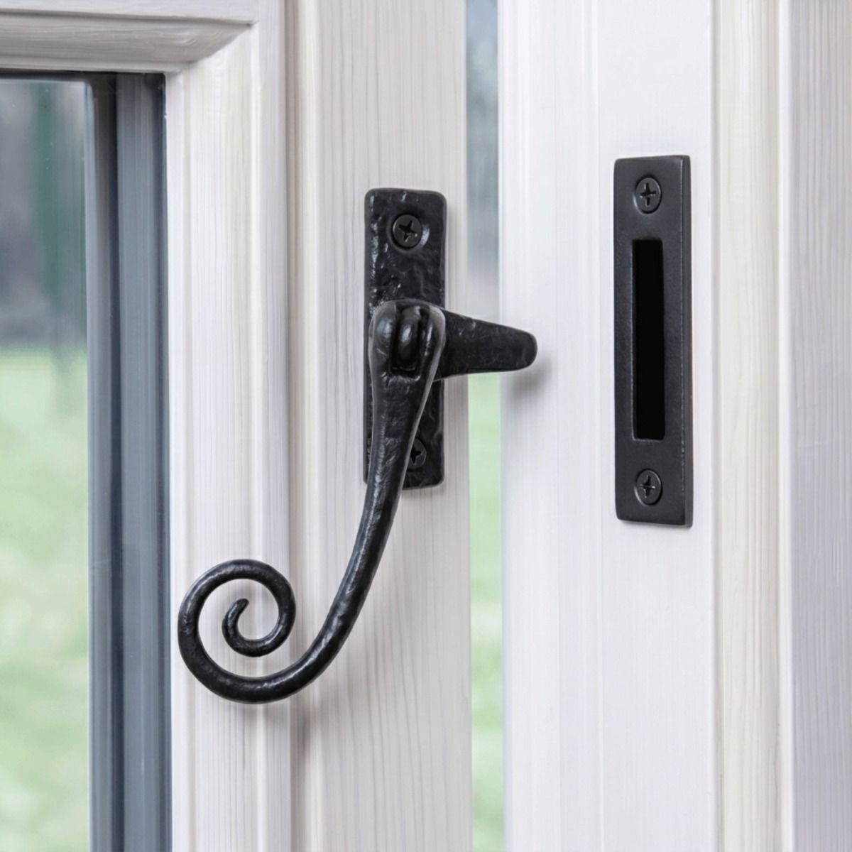 The Lockable Monkeytail Window Casement Fastener Fitted on a Classic White Window Frame in a Country Home - Digital Illustration