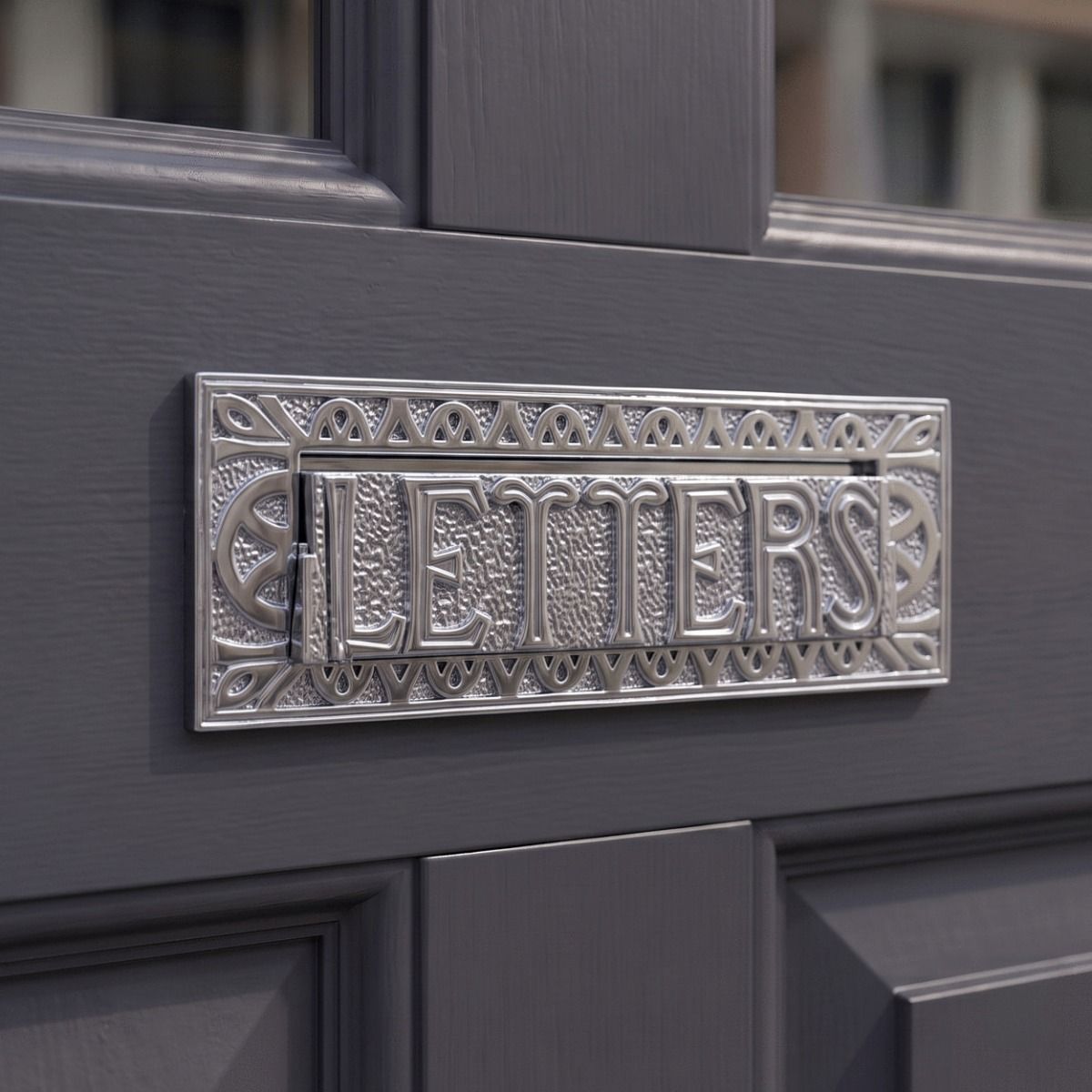 The “Mansford Park” Antique Brass Letter Plate in a Chrome Finish Fitted on a Grey Door with Glass Panels - Digital Illustration