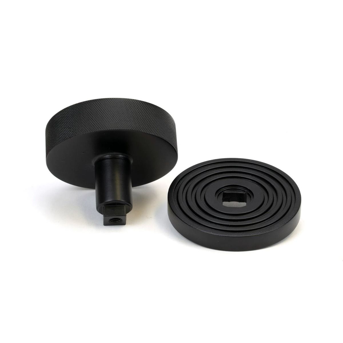 The Matt Black Knurled Centre Door Knob on a Beehive Rose Displayed in Separate Sections on a White Background 