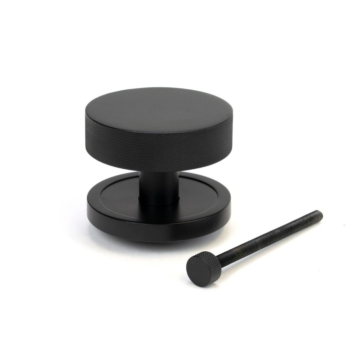 The Matt Black Knurled Centre Door Knob on a Plain Rose with Bolt Fitting on a White Background 