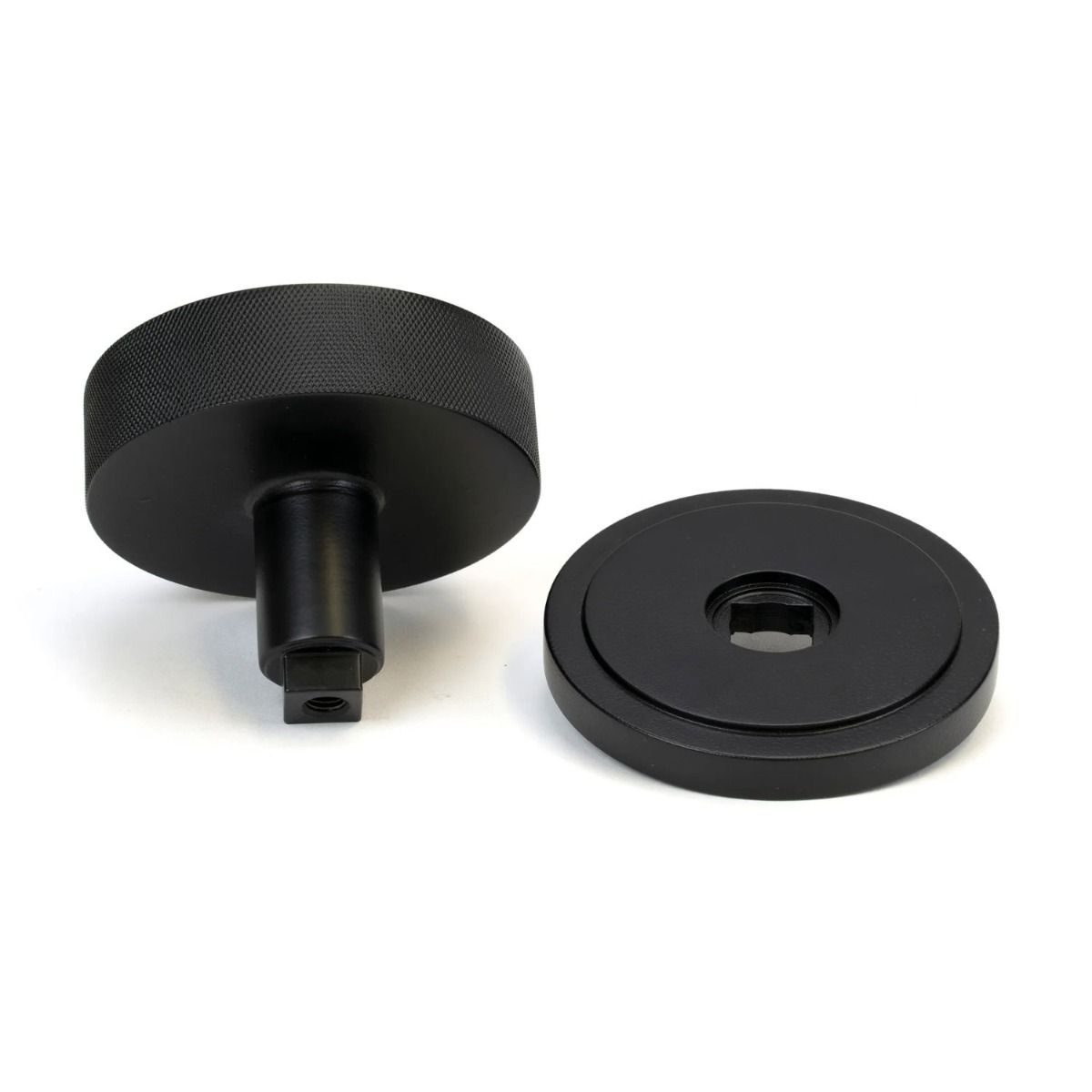 The Matt Black Knurled Centre Door Knob on an Art Deco Rose Displayed in Separate Sections on a White Background 