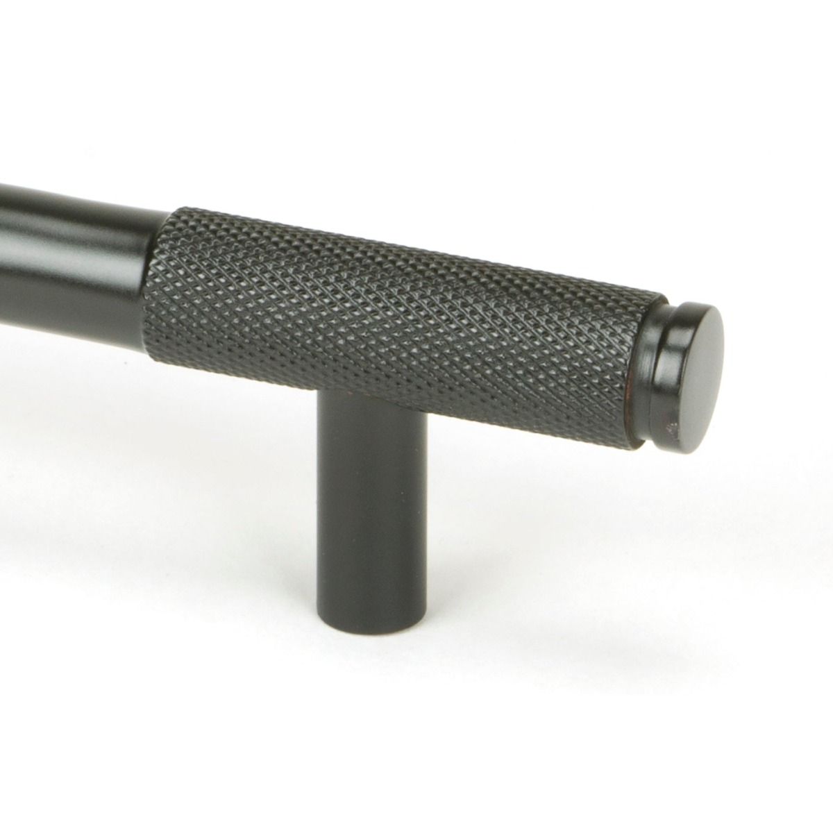 The Medium Half Knurled Cabinet Pull Handle in Aged Bronze Looking Close up of the End of the Knurled Handle