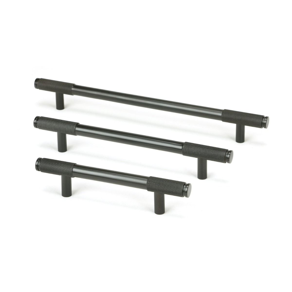 The Medium Knurled Cabinet Pull Handle in Aged Bronze Shown Alongside Other Sizes on a White Background