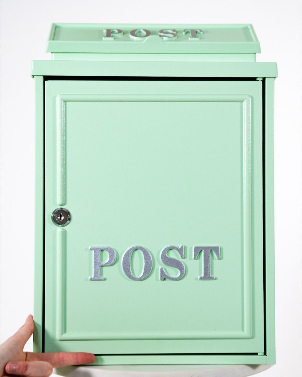 The Mint Green "Oxford" Wall Mounted Post Box with Silver Detail with Hnad in Shot for Scale