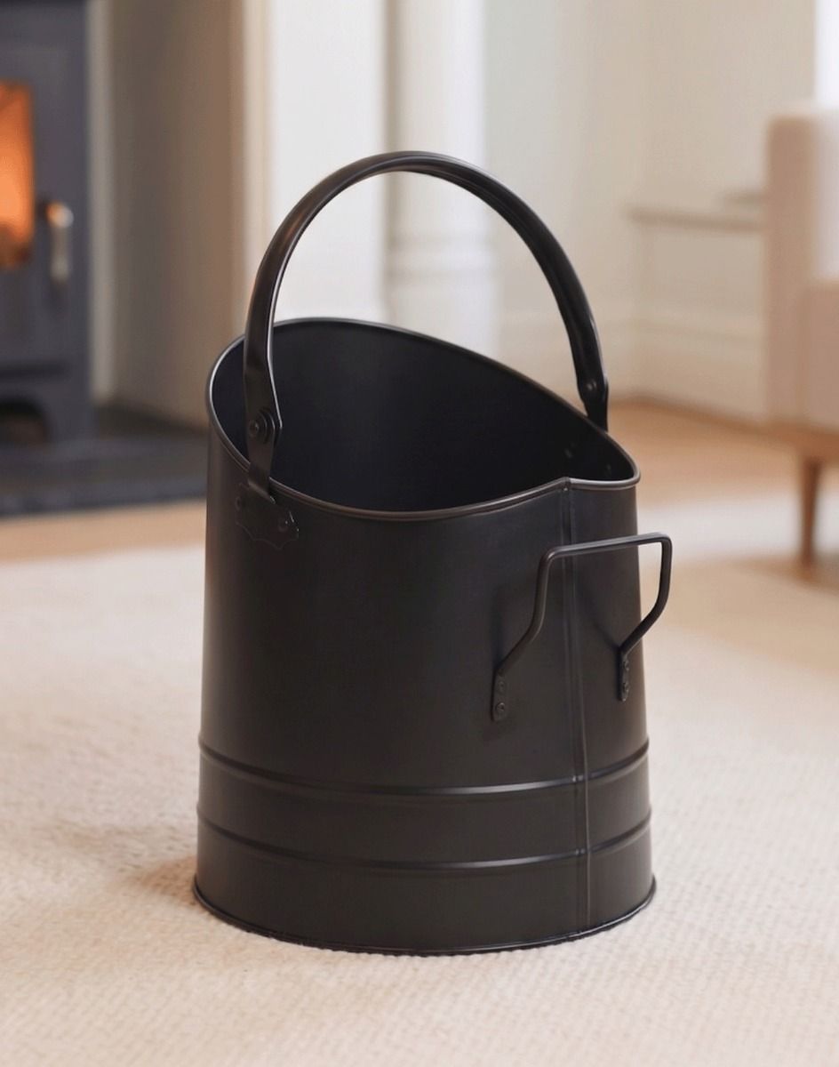 The Modern Black Coal Bucket Placed on a Carpet in Front of a Lob Burner Stove - Digital Illustration