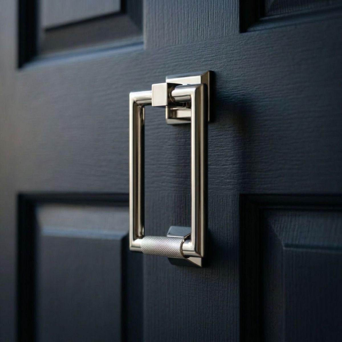 The Modern Knurled Rectangular Door Knocker in Polished Nickel on a Navy Front Entrance Door - Digital Illustration