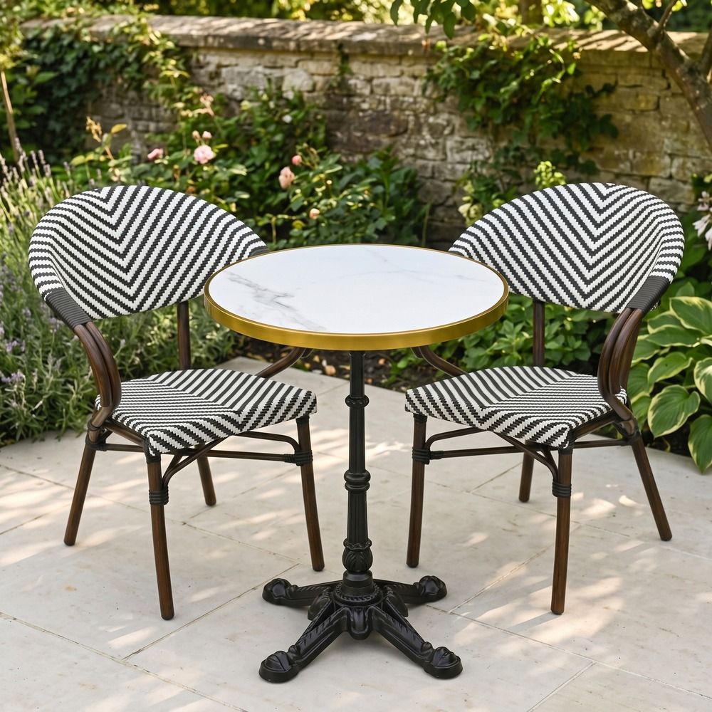 The Monaco Parisian Bistro Set in Black and White in a Sunny Low Walled Garden Surrounded by Plants