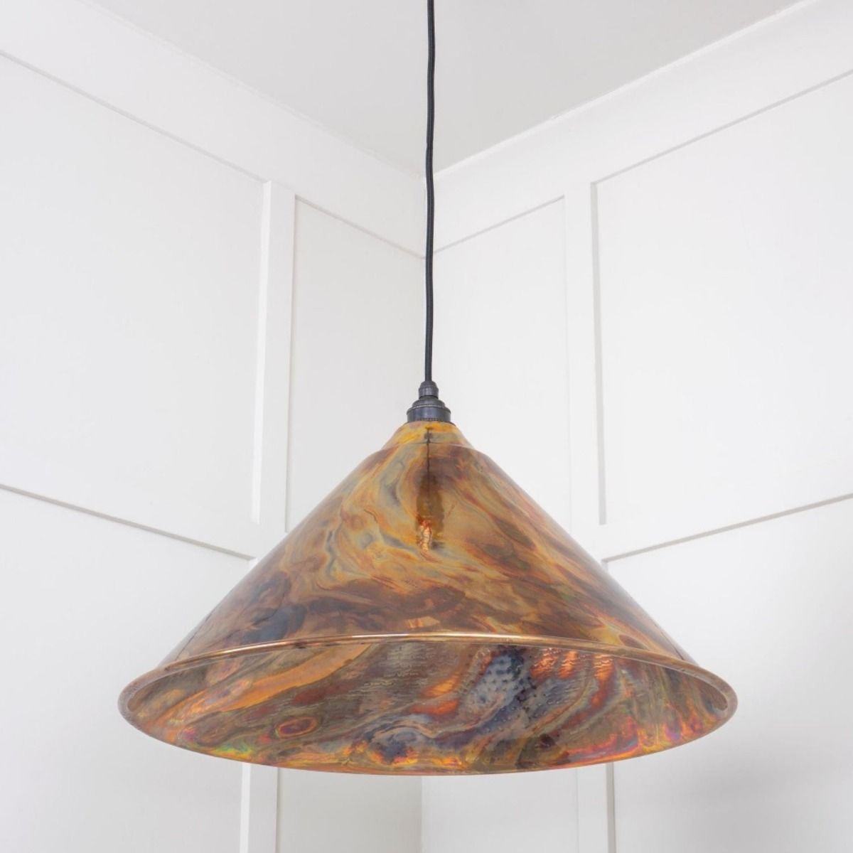The Nidus Pendant Light in a Burnished Finish Shown From a Low Angle