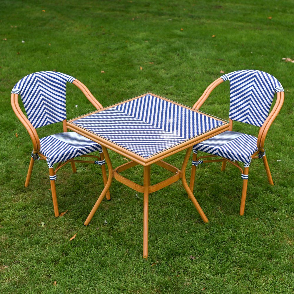 The Nizza Chevron Square Bistro Set in Blue & White Shown from a High Angle on a Lawn