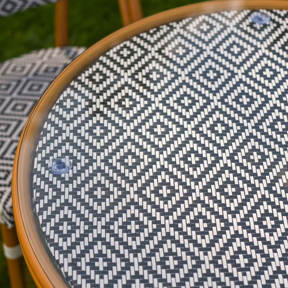 The Orbis Diamond 4-Seater Bistro Dining Set in Black & White Showing a Close up of the Glass Top Table