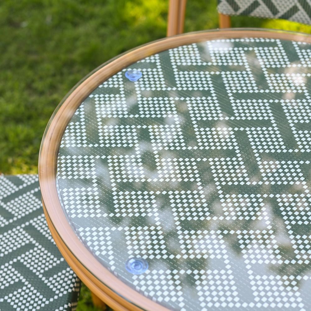 The Orbis Diamond 4-Seater Bistro Dining Set in Green & White Showing a Close up of the Glass Top Table