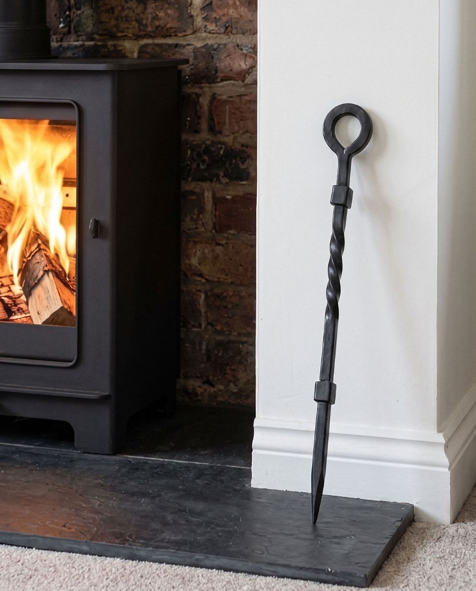 The “Pearson Place” Wrought Iron Fireside Poker Against a Log Basket in a Traditional Living Room - Digital Illustration 