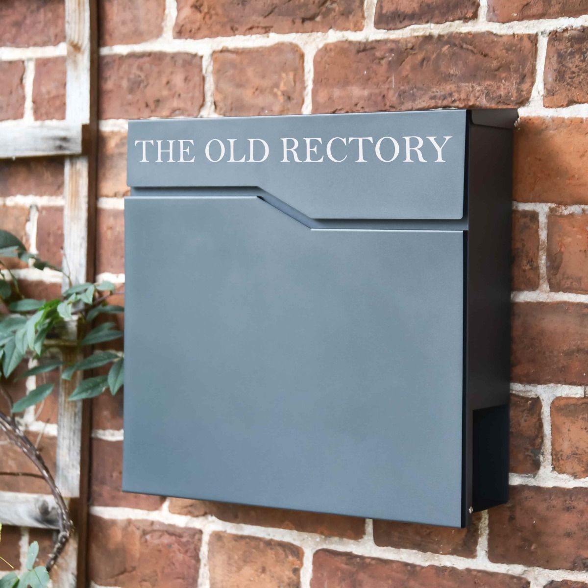 The Personalised Granite Grey _Staggered_ Wall Mounted Post Box & Newspaper Holder with a Customised House Name on the Top Panel - Digital Illustration 