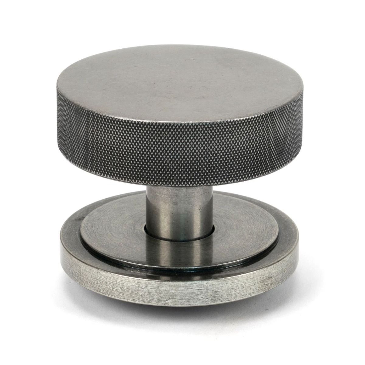 The Pewter Knurled Centre Door Knob on an Art Deco Rose on a White Background Shown Upright 