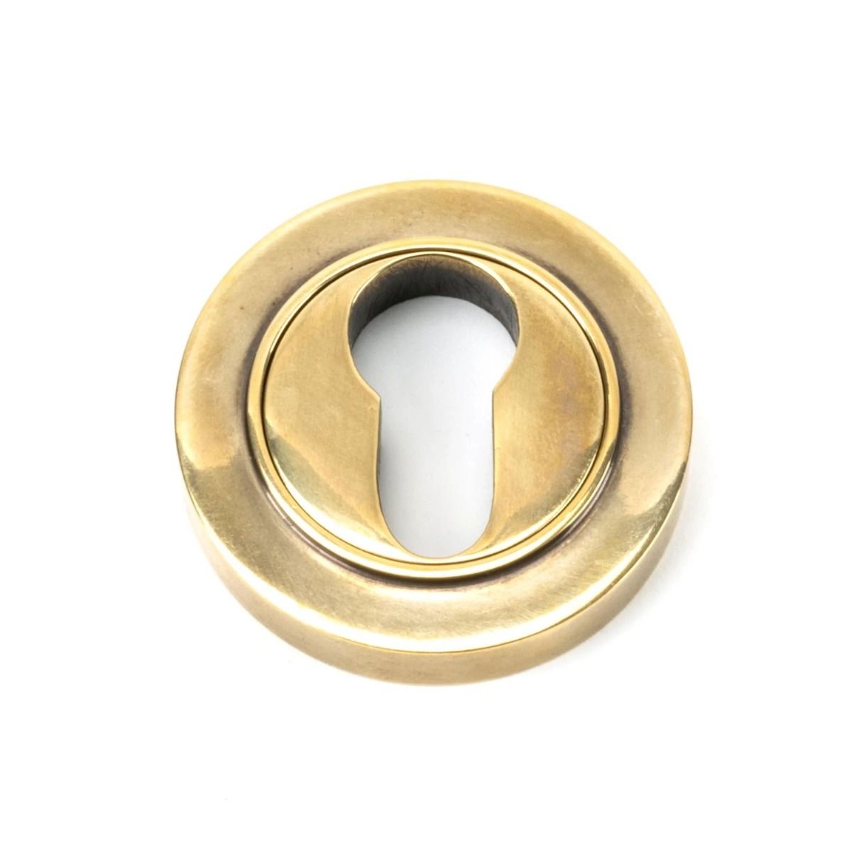 The Plain Concealed Standard Euro Escutcheon - Aged Brass on a White Background 