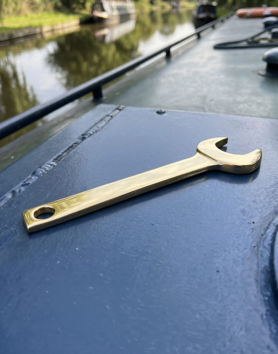 The Polished Brass Marine Spanner Shown Resting on Top of a Canal Boat - Digital Illustration 