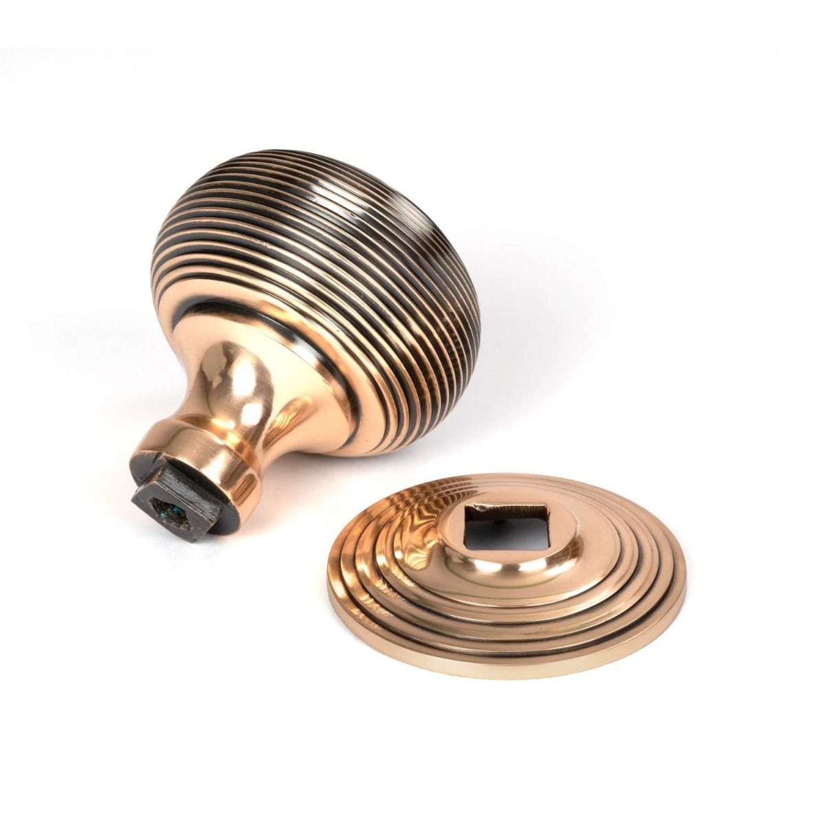 The Polished Bronze Traditional Beehive Centre Door Knob Shown from Behind with Rose