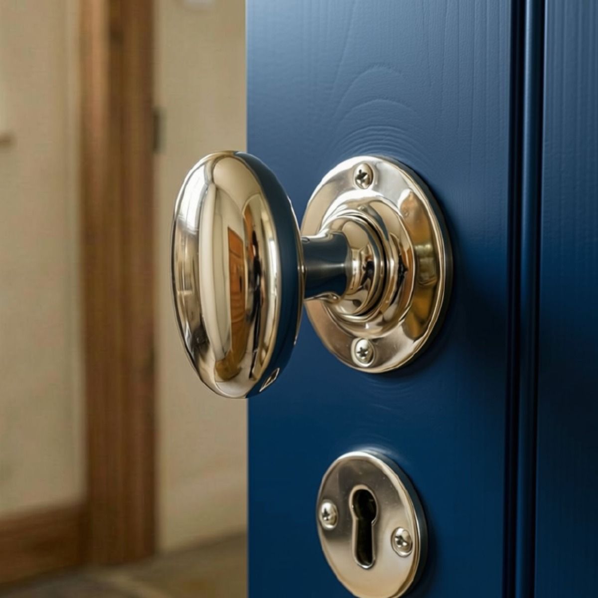 The Polished Nickel Oval Door Knob Set on a Blue Wooden Door inside a Modern Home - Digital Illustration 