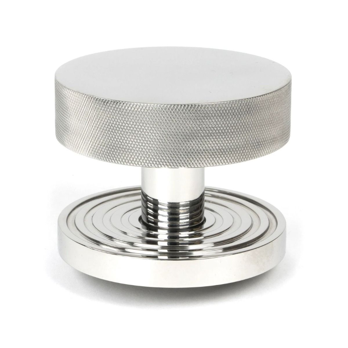 The Polished Stainless Steel Knurled Centre Door Knob on a Beehive Rose Shown Upright on a White Background 