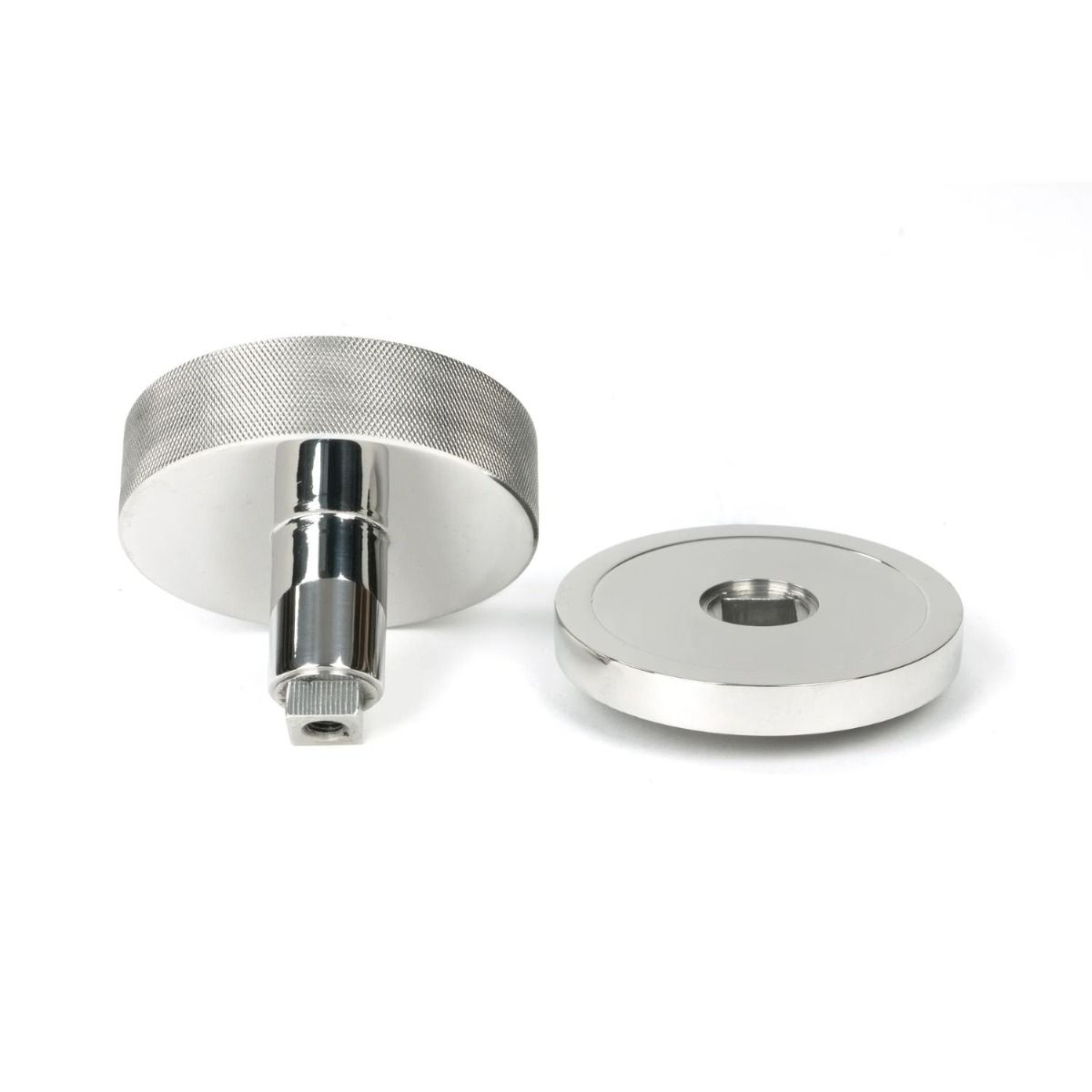 The Polished Stainless Steel Knurled Centre Door Knob on a Plain Rose Displayed in Separate Sections on a White Background 
