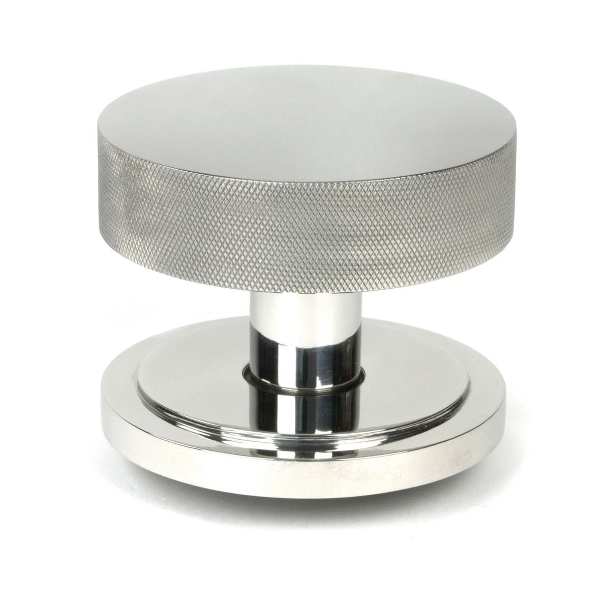 The Polished Stainless Steel Knurled Centre Door Knob on an Art Deco Rose Shown Upright on a White Background 