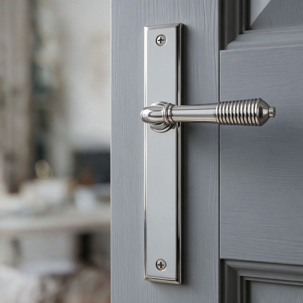The Reeded Slimline Lever Espagnolette Door Latch in Polished Chrome on a Grey Door in a Modern Property - Digital Illustration