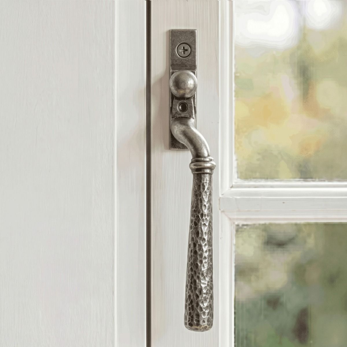 The Right Hand 16mm Hammered Pewter Espagnolette Window Handle on a White Painted Window Frame - Digital Illustration 