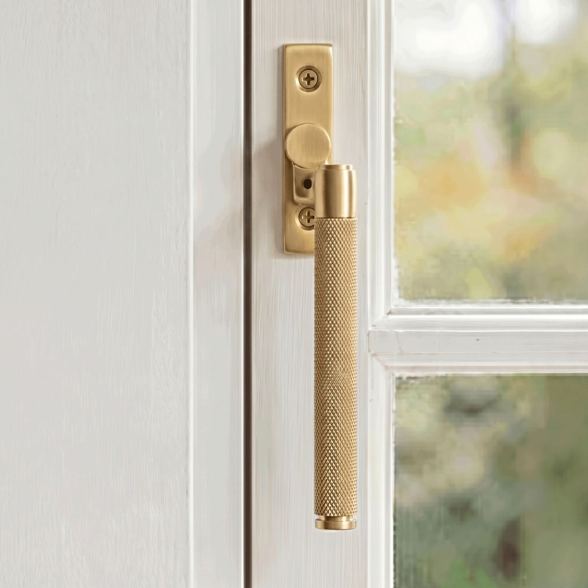 The Right Handed 16mm Satin Brass "Royale" Espagnolette Window Handle Fixed on a Handpainted White Window Frame - Digital Illustration 
